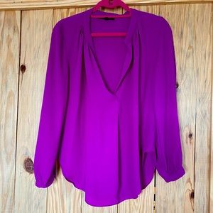 Fuscia colored top.